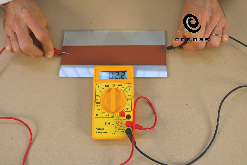 Copper based electroconductive paint. Measure the conductivity in Ohms on glass