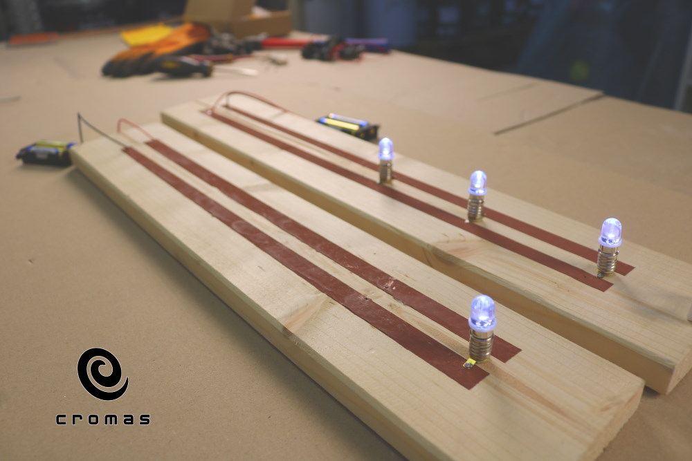 Copper based electroconductive paint. Light up LED diodes and measure the voltage