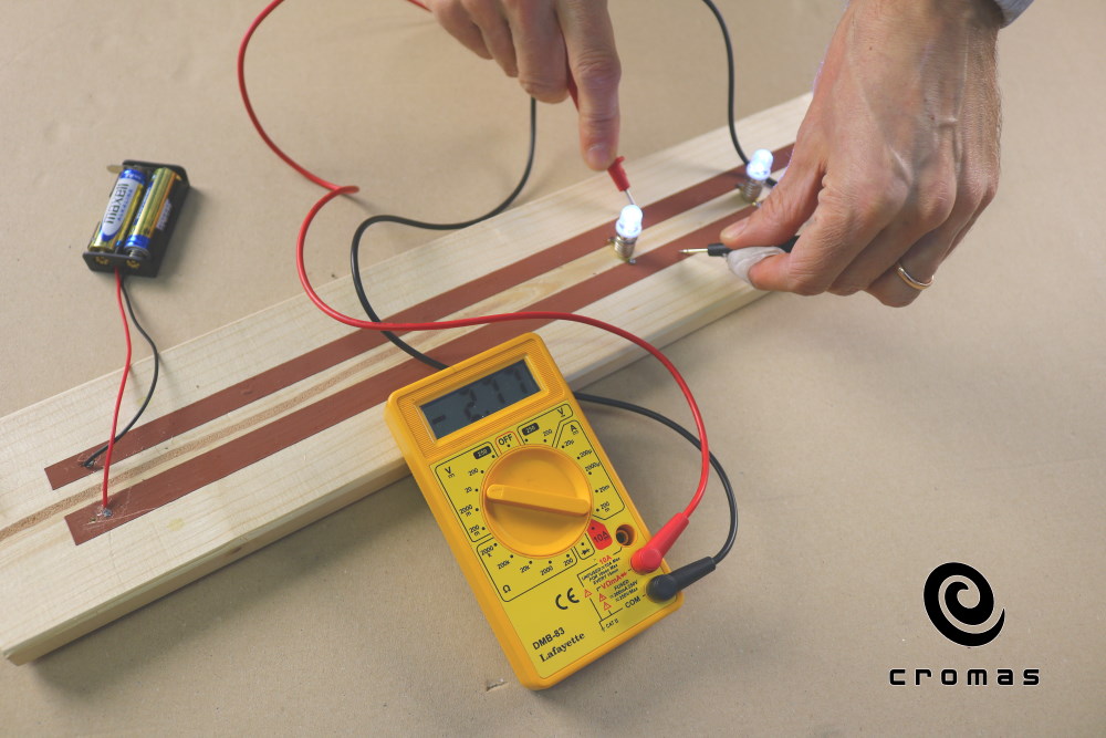 Copper based electroconductive paint. Light up LED diodes and measure the voltage